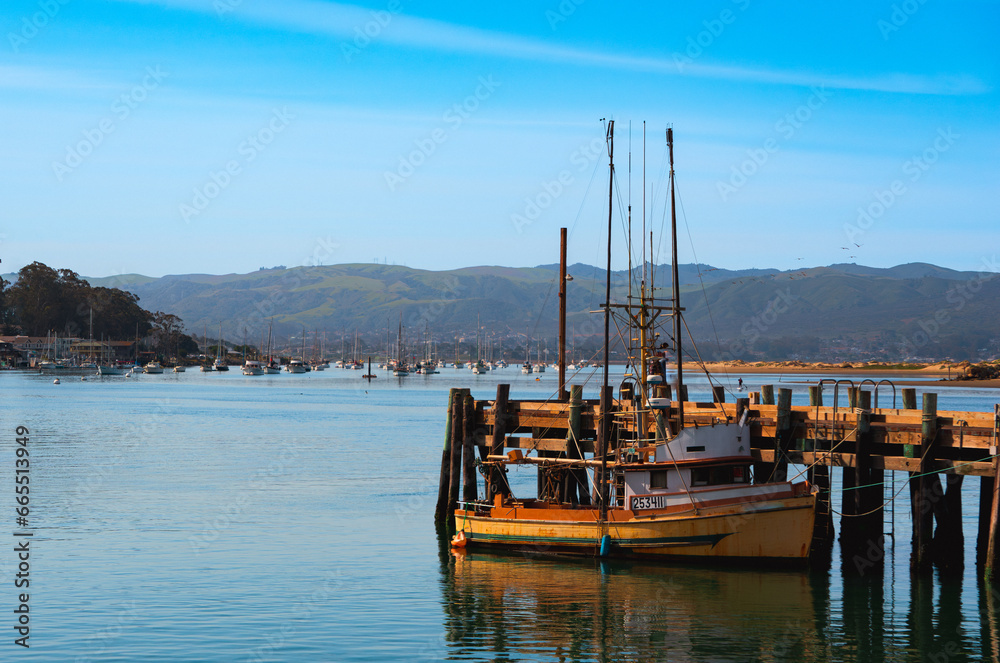 A boat in the bay of Morro Bay, California, USA, on a bright sunny spring day.