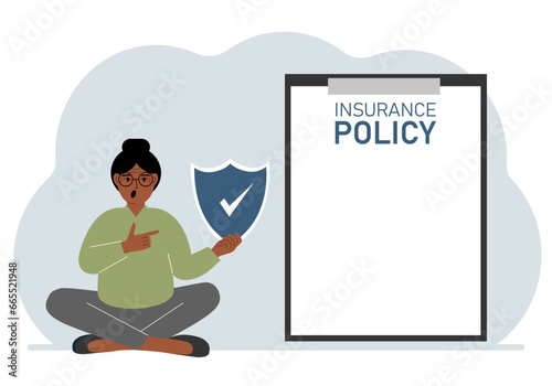 A woman holds an insurance policy sign in his hands. The concept of life insurance, property or natural disasters.