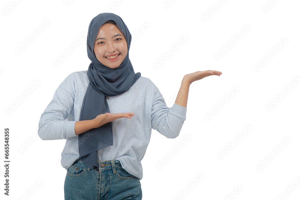 Young Asian Hijab Woman with Presenting Hands Pose Young Asian Hijab Woman with Presenting Hands Pose