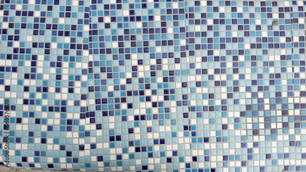 Mosaic square tiles with blue and white gradient. Square bricks, background texture. Tile wallpaper. natural surface weathering Mosaic square tiles with blue and white gradient. Square bricks, background texture. Tile wallpaper. natural surface weathering
