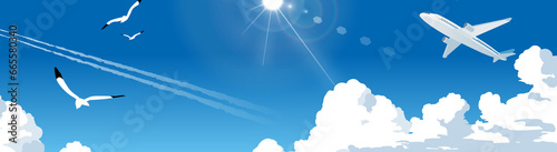 青空を飛ぶ飛行機と入道雲のイラスト