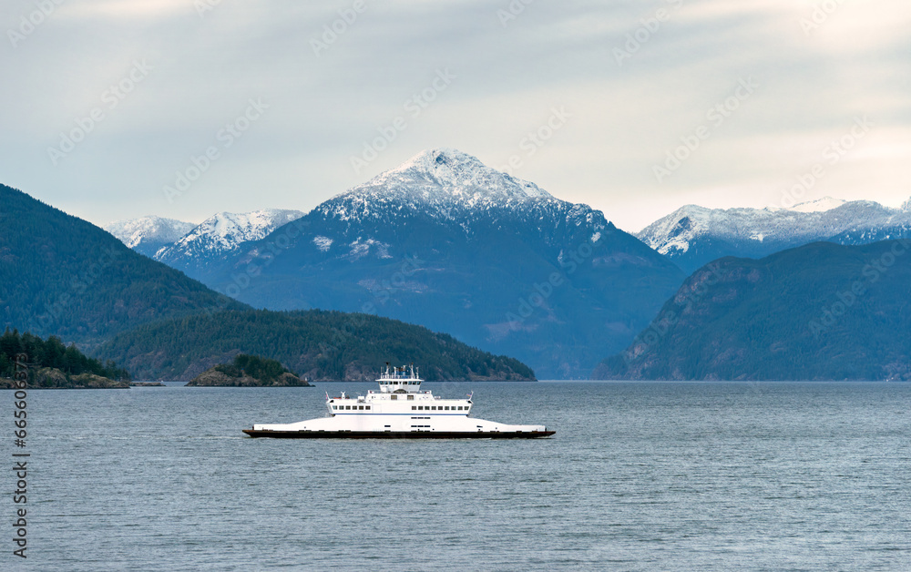 Smaller ferry vessel going by Pacific ocean bay Smaller ferry vessel going by Pacific ocean bay