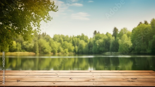 Empty wooden table on blurred river and forest bench background.  photo