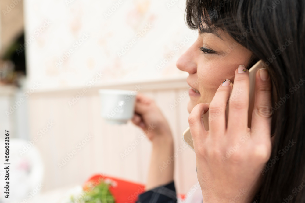 Woman drinking coffee at a coffee shop Woman drinking coffee at a coffee shop