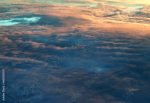 Sky landscape. Mesmerizing clouds on the background of sunset. Layered clouds.