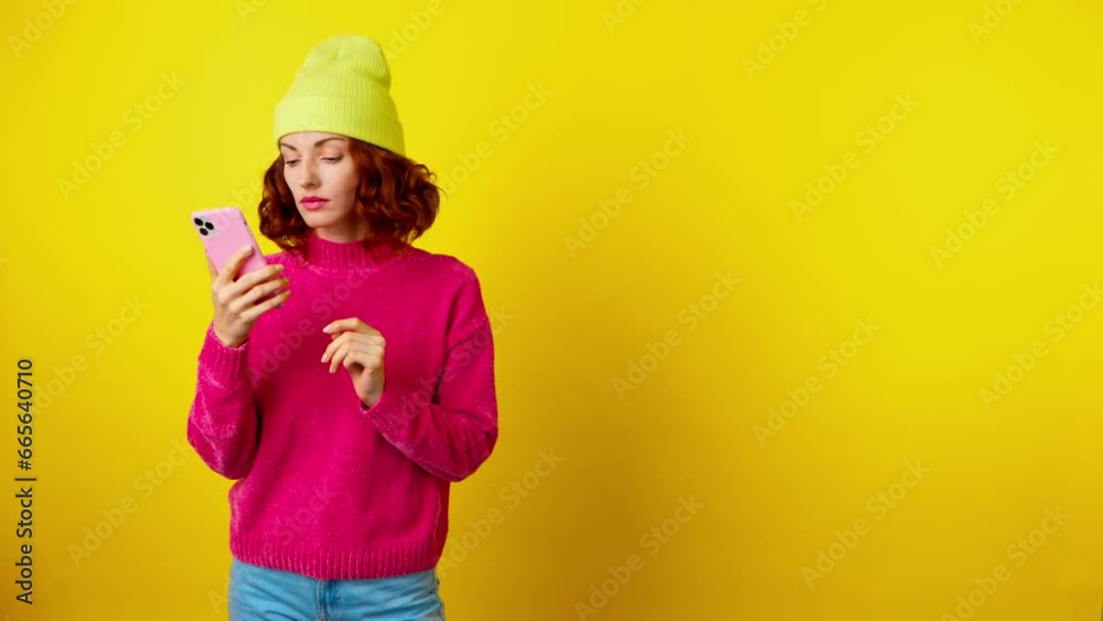 Woman, mobile cell phone, say Yes Wow and celebration for winning, discount or sale on yellow studio background. Excited female lady with smartphone for social media, online streaming, news, internet