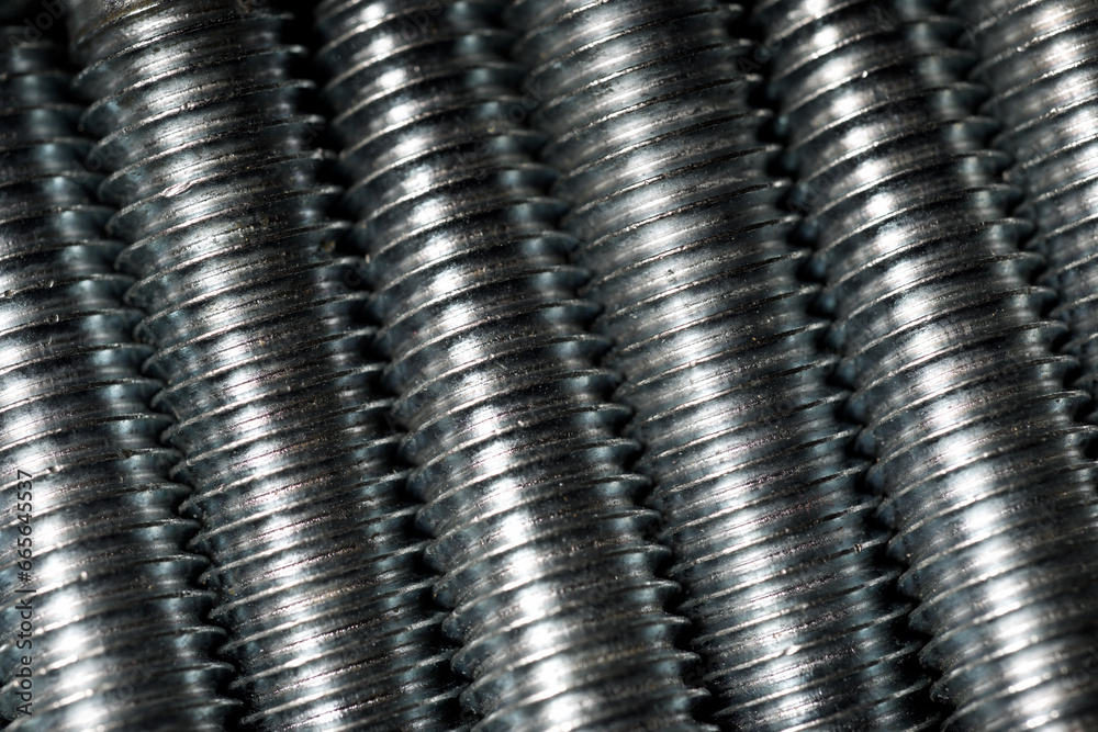 Close-up of the thread of some metal screws Close-up of the thread of some metal screws