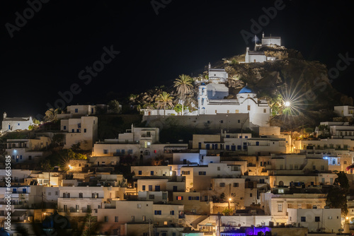 Panoramic view of the picturesque illuminated island of Ios in Greece at night © DIMITRIOS
