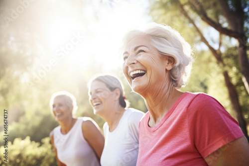 Senior women smiling during yoga or pilates exercise outdoors 