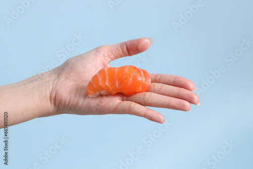 Hand with Sushi