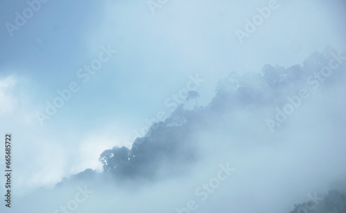 landscape of mountain with mist at Nang rong waterfall travel location in Thailand