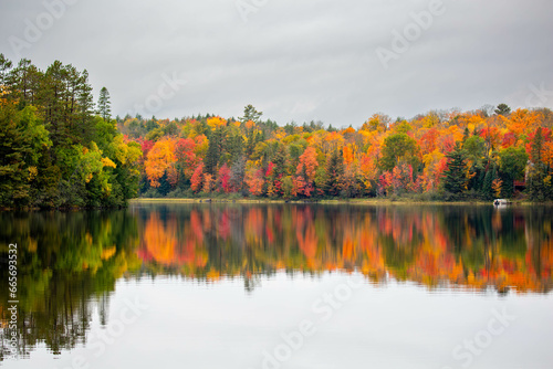 Colorful autumn trees on lake of the Falls in Mercer, Wisconsin