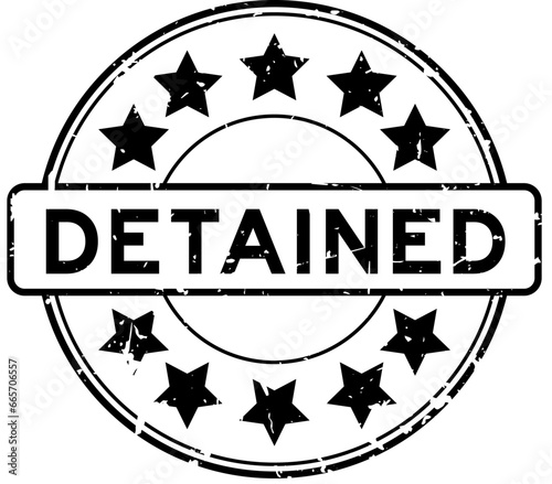 Grunge black detained word round rubber seal stamp on white backgroundr