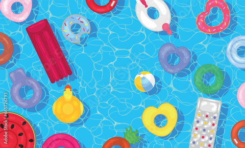 Inflatable rings and mattresses in swimming pool, top view