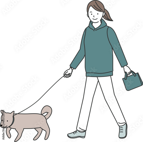 犬の散歩をする女性