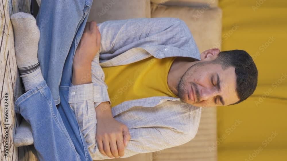 Vertical video of Sad man crying at home. Vertical video of Sad man crying at home.