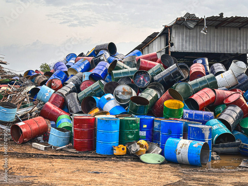 фотографія Pile of discarded barrels at a junkyard