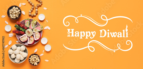 Greeting card for Happy Diwali (Festival of lights) with sweet treats and candles © Pixel-Shot