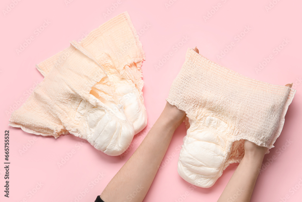 Woman with period panties on pink background