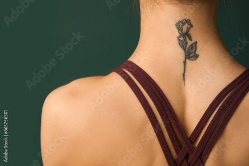 Young woman with tattooed n...