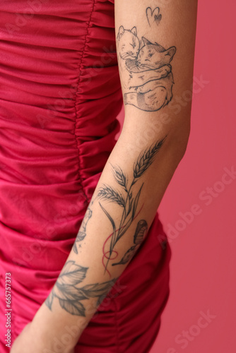 Young woman with tattooed a...