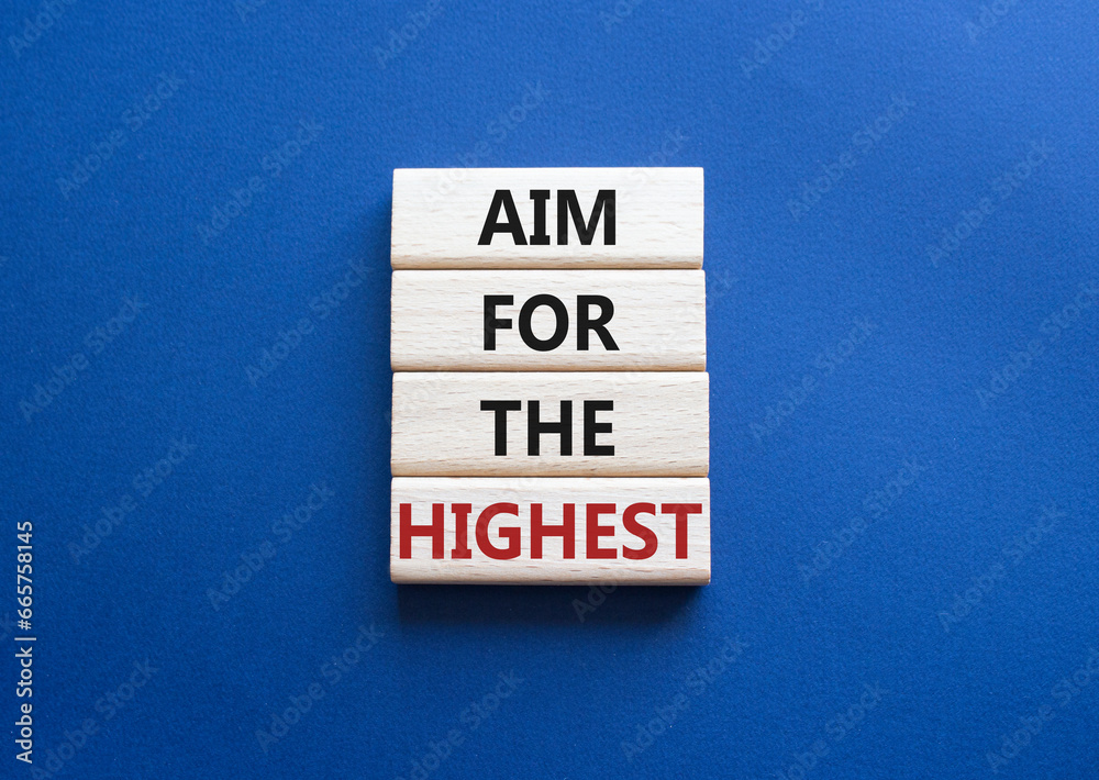 Aim for the Highest symbol. Concept words Aim for the Highest on wooden blocks. Beautiful deep blue background. Business and Aim for the Highest concept. Copy space. Aim for the Highest symbol. Concept words Aim for the Highest on wooden blocks. Beautiful deep blue background. Business and Aim for the Highest concept. Copy space.