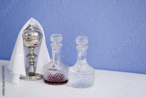 cruets with water and wine and chalice photo