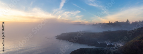 Scenic View of the Coastline on the West Pacific Ocean Coast. Foggy Sunset.