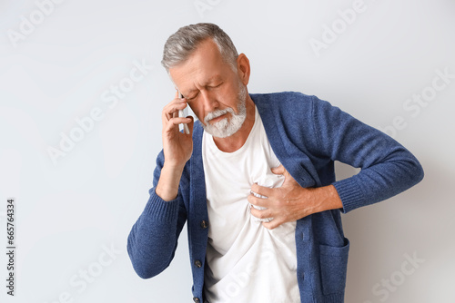 Mature man with heart attac...
