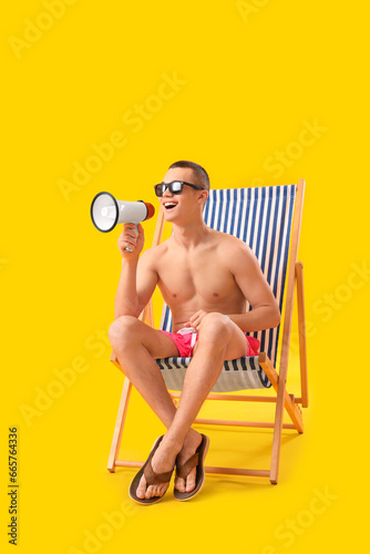 Teenage boy with megaphone ...