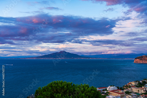 Fototapeta Naklejka Na Ścianę i Meble -  View of Mount Vesuvius across the Bay of Naples in Italy at dusk