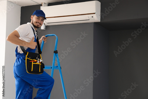 Male technician showing thu...