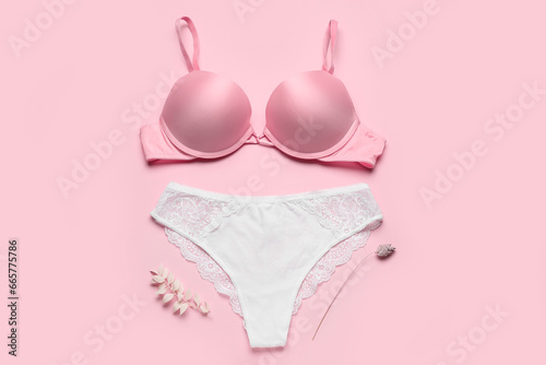 Beautiful female underwear on pink background