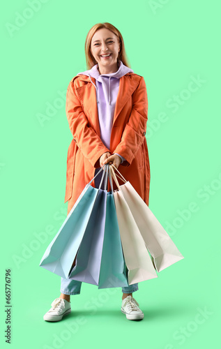 Mature woman in coat with s...
