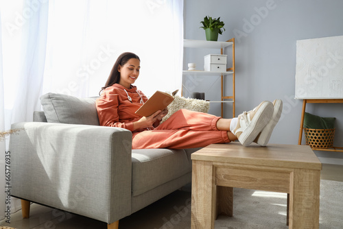 Young woman in hoodie readi...