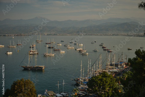 View from the mountain of the morning port city with parking for sailing yachts.