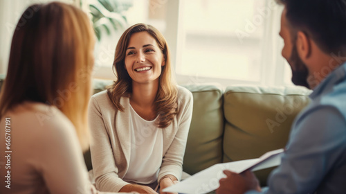 Young couple having a discussion together in a therapist's therapy room.