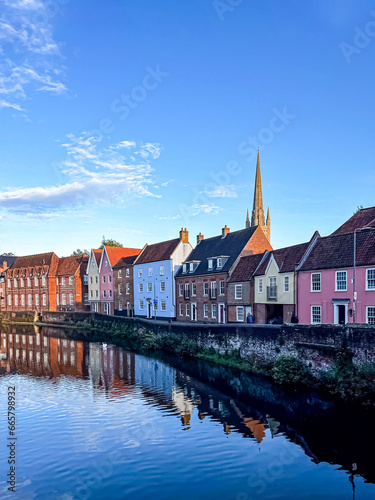 View of river Wensum and buildings on the side in Norwich. Selective focus