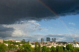 Cloudy sky and a rainbow over Pankrac, a modern district with skyscrapers in Prague, Czech Republic