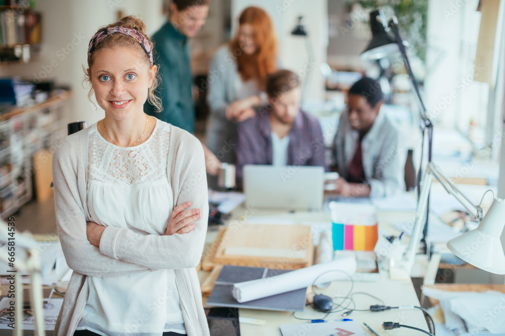 Portrait of a young smiling designer in a modern office Portrait of a young smiling designer in a modern office