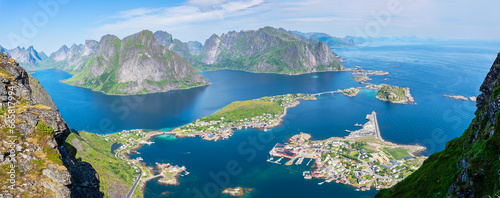 View from the Reinebringen mountain (448 m) over Reinefjorden to the fishing village Reine and the mountain range of the Lofoten, Norway photo