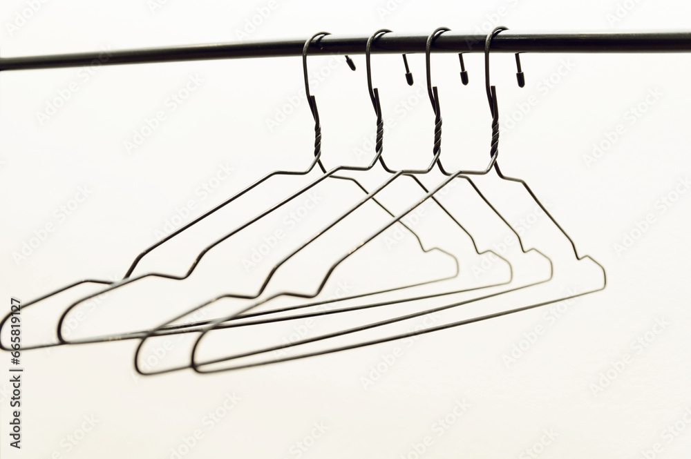 rack with black hangers on a white background.
