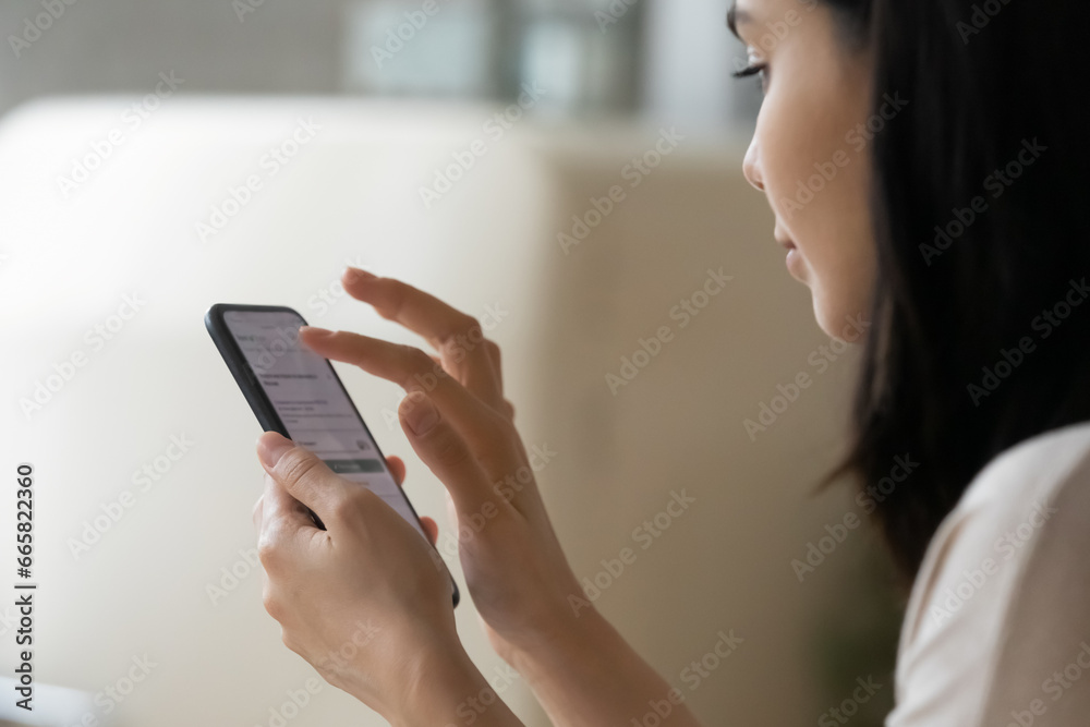 Close up Asian woman using phone, surfing internet, chatting online, looking at smartphone screen, typing writing message in social network, young female holding cellphone, scrolling, browsing apps - obrazy, fototapety, plakaty 
