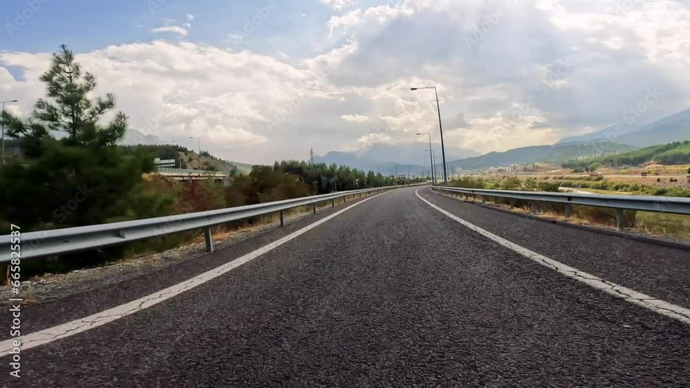 Drive on mountain road with black asphalt. Travel by car, first-person view. Drive on mountain road with black asphalt. Travel by car, first-person view.