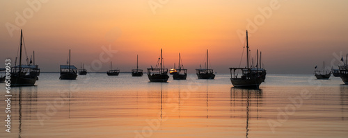 dhows in the shore parked at katara beach in qartar during dhow festival. photo