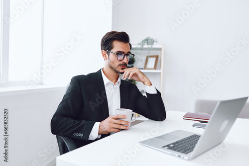 Looking man business tired glasses desk laptop office sitting working thinking