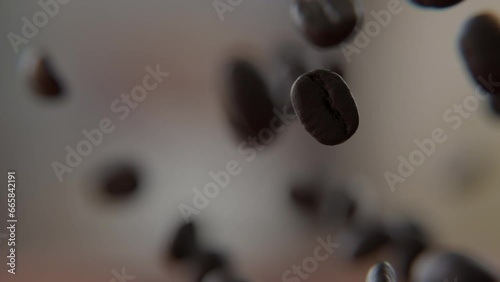 Close up of Coffee beans falling on and bouncing off of the wooden table