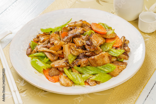 Special Chinese mushroom stir-fried meat on simple background