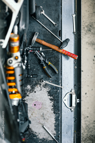 different tools on authentic workbench in workshop for car or bike repair