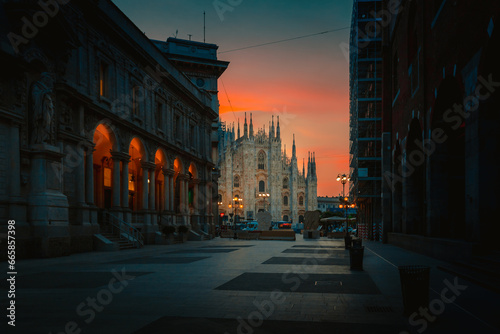 Fototapeta Naklejka Na Ścianę i Meble -  Milan Cathedral Square Milan Cathedral (Duomo di Milano) at sunrise from Merchants Square, no people